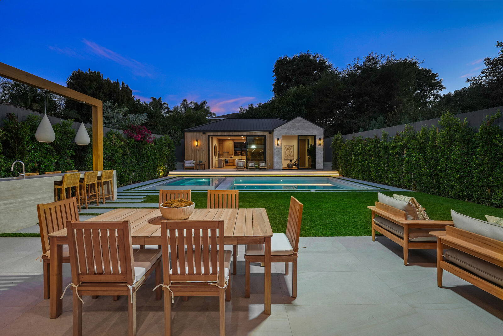 San Fernando Valley backyard pool and guesthouse at dusk