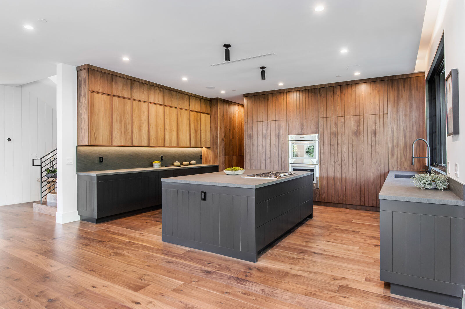 Contemporary wood kitchen with a dark island in Van Nuys